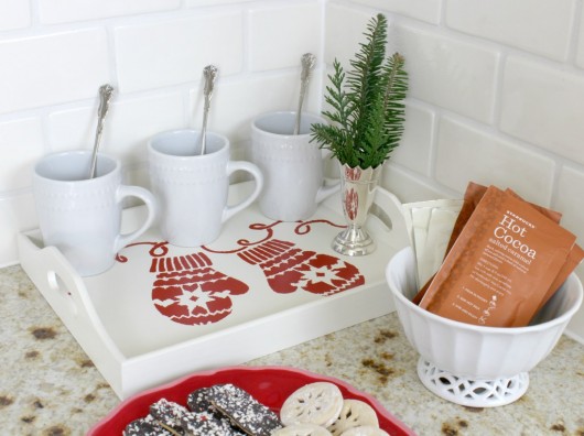 A DIY stenciled wooden tray for a hot cocoa bar using the Mittens Craft Stencil from Cutting Edge Stencils. http://www.cuttingedgestencils.com/mittens-holiday-decor-stencils-for-diy-crafts.html