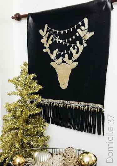 A DIY stenciled tapestry wall art using the Reindeer Craft Stencil from Cutting Edge Stencils. http://www.cuttingedgestencils.com/reindeer-holiday-stencil-designs-for-diy-crafts.html