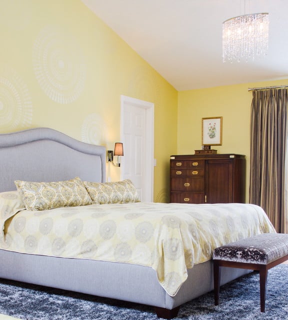 A DIY stenciled accent wall in a yellow bedroom featuring the Funky Wheel Stencil from Cutting Edge Stencils. http://www.cuttingedgestencils.com/funky-wall-stencils.html