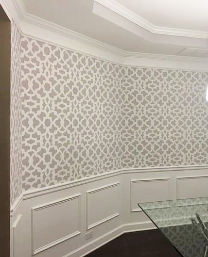 A DIY gray and white stenciled dining room wall using the Zamira Allover Stencil from Cutting Edge Stencils. http://www.cuttingedgestencils.com/moroccan-stencil-designs.html