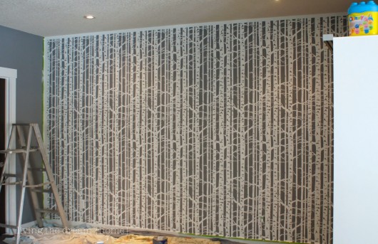 A DIY stenciled accent wall in a family room using the Birch Forest Allover Stencil from Cutting Edge Stencils. http://www.cuttingedgestencils.com/allover-stencil-birch-forest.html