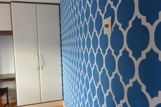 A DIY stenciled accent wall in blue using the Casablanca Allover Stencil from Cutting Edge Stencils. http://www.cuttingedgestencils.com/allover-stencils.html