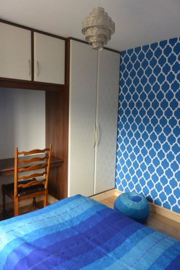 A DIY stenciled accent wall in blue using the Casablanca Allover Stencil from Cutting Edge Stencils. http://www.cuttingedgestencils.com/allover-stencils.html