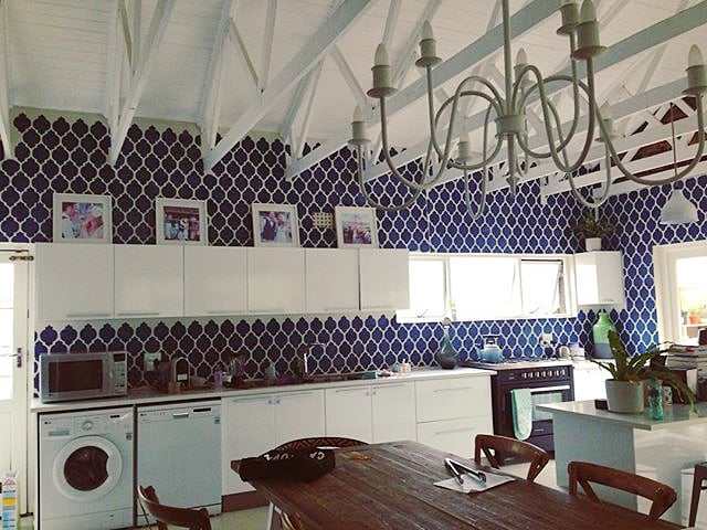 A blue and white DIY stenciled kitchen using the Casablanca Allover Stencil from Cutting Edge Stencils. http://www.cuttingedgestencils.com/allover-stencils.html