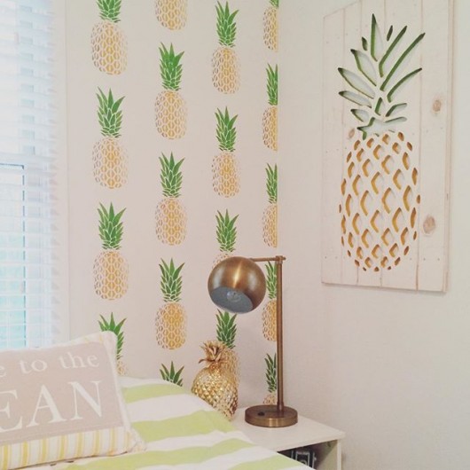 A DIY stenciled accent wall in a guest bedroom using the Pineapple Allover Stencil from Cutting Edge Stencils. http://www.cuttingedgestencils.com/pineapple-fruit-allover-stencil-pattern-design.html