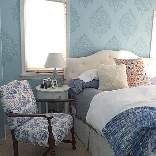 A DIY blue stenciled bedroom accent wall using the Nadya Damask Stencil from Cutting Edge Stencils. http://www.cuttingedgestencils.com/damask-moroccan-stencil.html