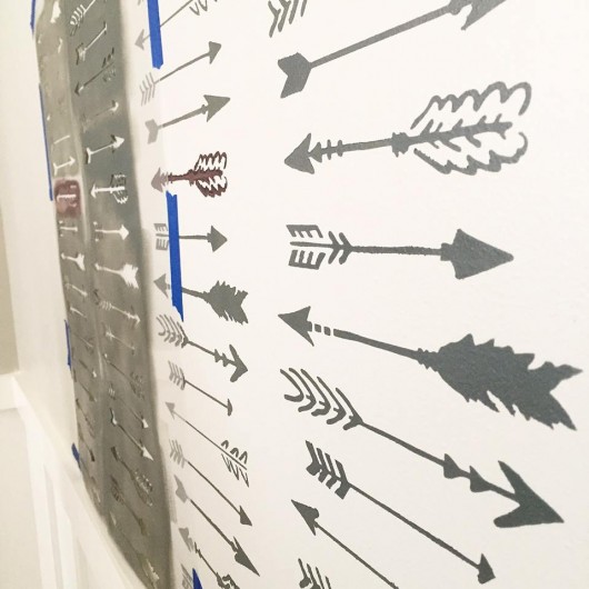 Stenciling a DIY nursery accent wall using the Indian Arrows Allover Stencil from Cutting Edge Stencils. http://www.cuttingedgestencils.com/indian-arrows-stencil-pattern-for-walls.html