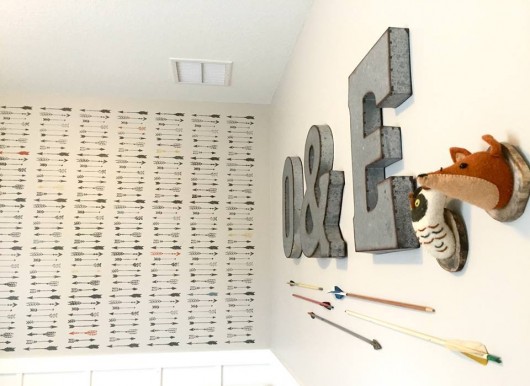 A DIY stenciled nursery accent wall using the Indian Arrows Allover Stencil from Cutting Edge Stencils. http://www.cuttingedgestencils.com/indian-arrows-stencil-pattern-for-walls.html