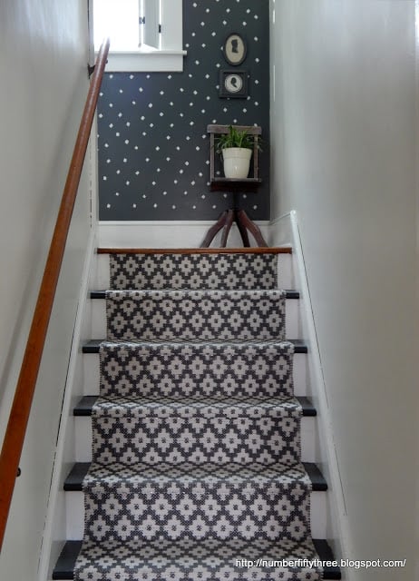A DIY stenciled hallway accent wall in navy and white using the Little Diamonds Allover Stencil from Cutting Edge Stencils. http://www.cuttingedgestencils.com/little-diamonds-pattern-stencil-for-walls.html