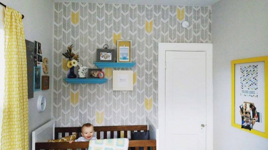 A DIY stenciled nursery accent wall in gray and yellow using the Drifting Arrows Allover Stencil from Cutting Edge Stencils. http://www.cuttingedgestencils.com/drifting-arrows-stencil-pattern-diy-decor.html