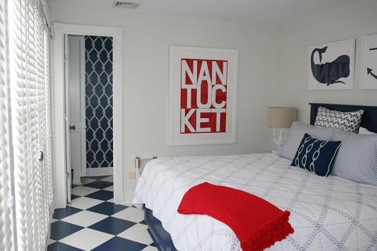 A DIY navy and white stenciled bathroom in a beach home using the Perfect Catch Stencil from Cutting Edge Stencils. http://www.cuttingedgestencils.com/perfect-catch-stencil-beach-decor.html