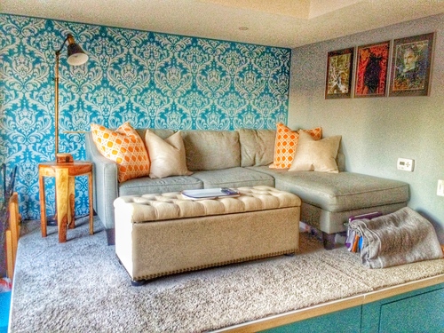 A DIY teal stenciled accent wall in an apartment using the Anna Damask Stencil from Cutting Edge Stencils. http://www.cuttingedgestencils.com/damask-stencil.html