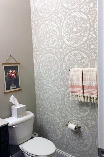 A DIY stenciled powder room accent wall using the Charlotte Allover Stencil from Cutting Edge Stencils. http://www.cuttingedgestencils.com/charlotte-allover-stencil-pattern.html
