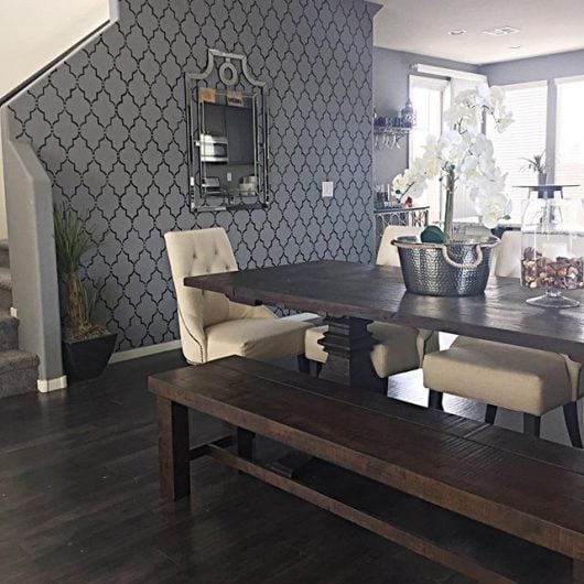 A DIY stenciled dining room accent wall in gray and black using the Marrakech Trellis Allover Stencil from Cutting Edge Stencils. http://www.cuttingedgestencils.com/moroccan-stencil-marrakech.html