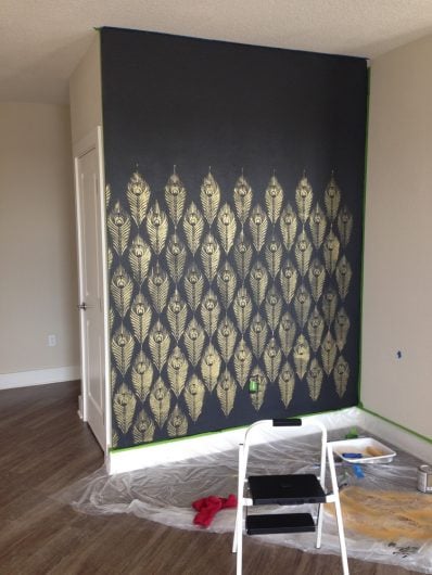Stenciling an accent wall using Deep Onyx from Glidden and the Peacock Feather Allover Stencil from Cutting Edge Stencils in Ralph Lauren Gold paint. http://www.cuttingedgestencils.com/peacock-feather-wall-stencil-pattern.html