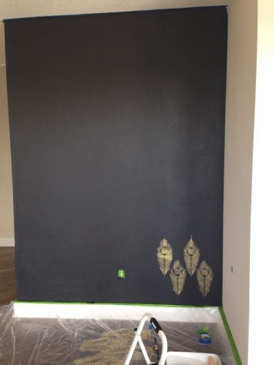 Stenciling an accent wall using Deep Onyx from Glidden and the Peacock Feather Allover Stencil from Cutting Edge Stencils in Ralph Lauren Gold paint. http://www.cuttingedgestencils.com/peacock-feather-wall-stencil-pattern.html