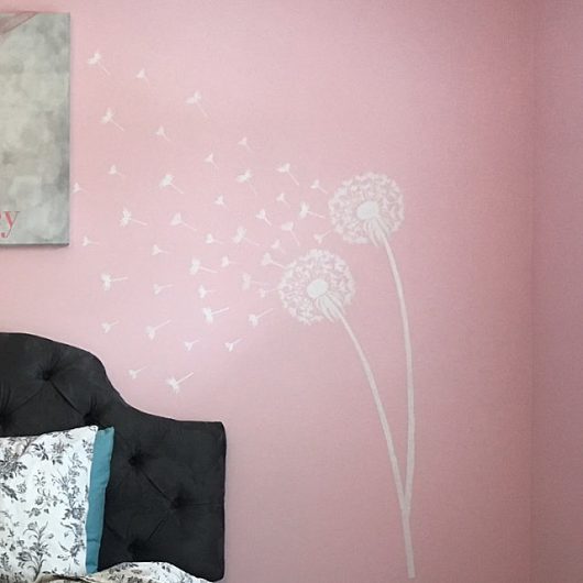 A DIY pink and white stenciled accent wall using popular flower stencils, the Dandelion Stencil, from Cutting Edge Stencils. http://www.cuttingedgestencils.com/dandelion-stencil.html