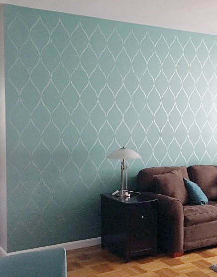 A DIY stenciled living room accent wall using the SErenity Allover Stencil from Cutting Edge Stencils. http://www.cuttingedgestencils.com/serenity-allover-stencil-trellis-design-wall-pattern-diy-decor.html
