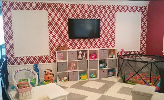 A DIY stenciled red and white playroom accent wall using the Tamara Trellis Allover Stencil from Cutting Edge Stencils. http://www.cuttingedgestencils.com/tamara-trellis-allover-wall-stencils.html
