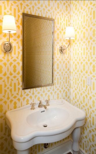 A yellow and white DIY stenciled powder room using the Trellis Allover Stencil from Cutting Edge Stencils. http://www.cuttingedgestencils.com/allover-stencil.html