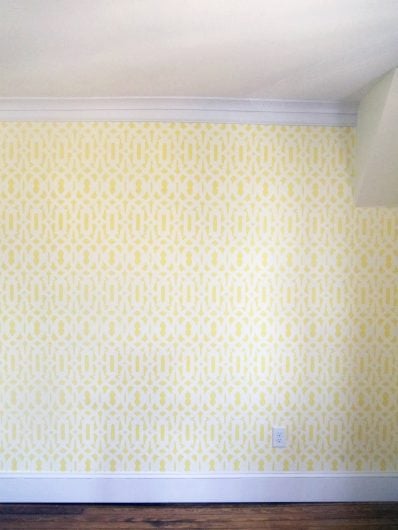 A yellow and white DIY stenciled room mimicking wallpaper using the Trellis Allover Stencil from Cutting Edge Stencils. http://www.cuttingedgestencils.com/allover-stencil.html
