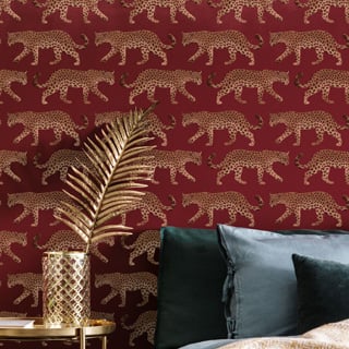 Animal stencils leopards on a burgundy wall