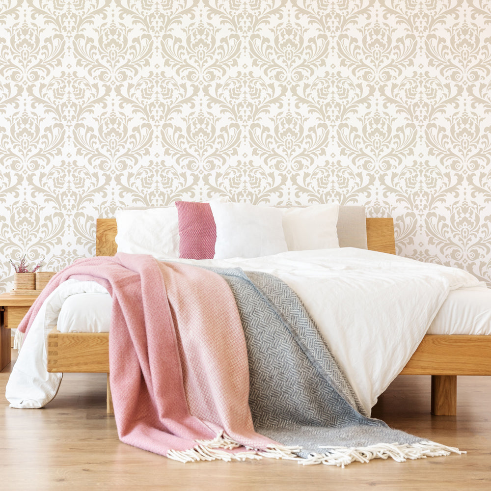 Damask stenciled wallpaper design on bedroom wall