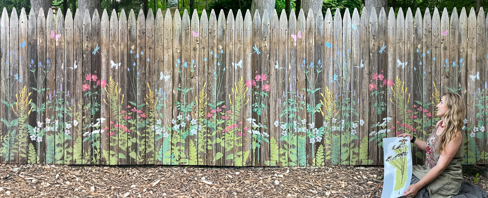 Stenciled outdoor fence with large floral stencils