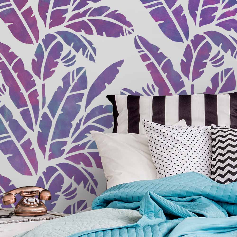 tropical banana leaf stenciled bedroom wall