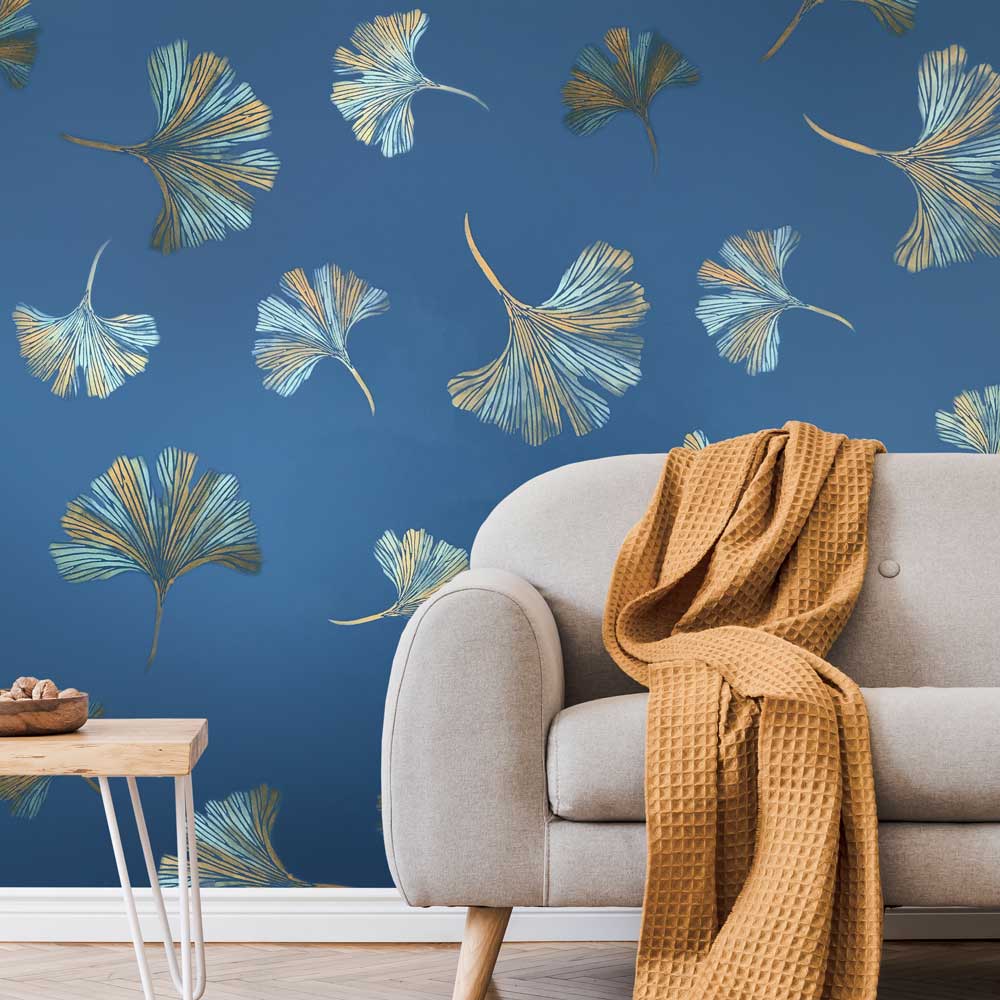 chinese ginkgo wall stencil in gold metallic on a blue wall