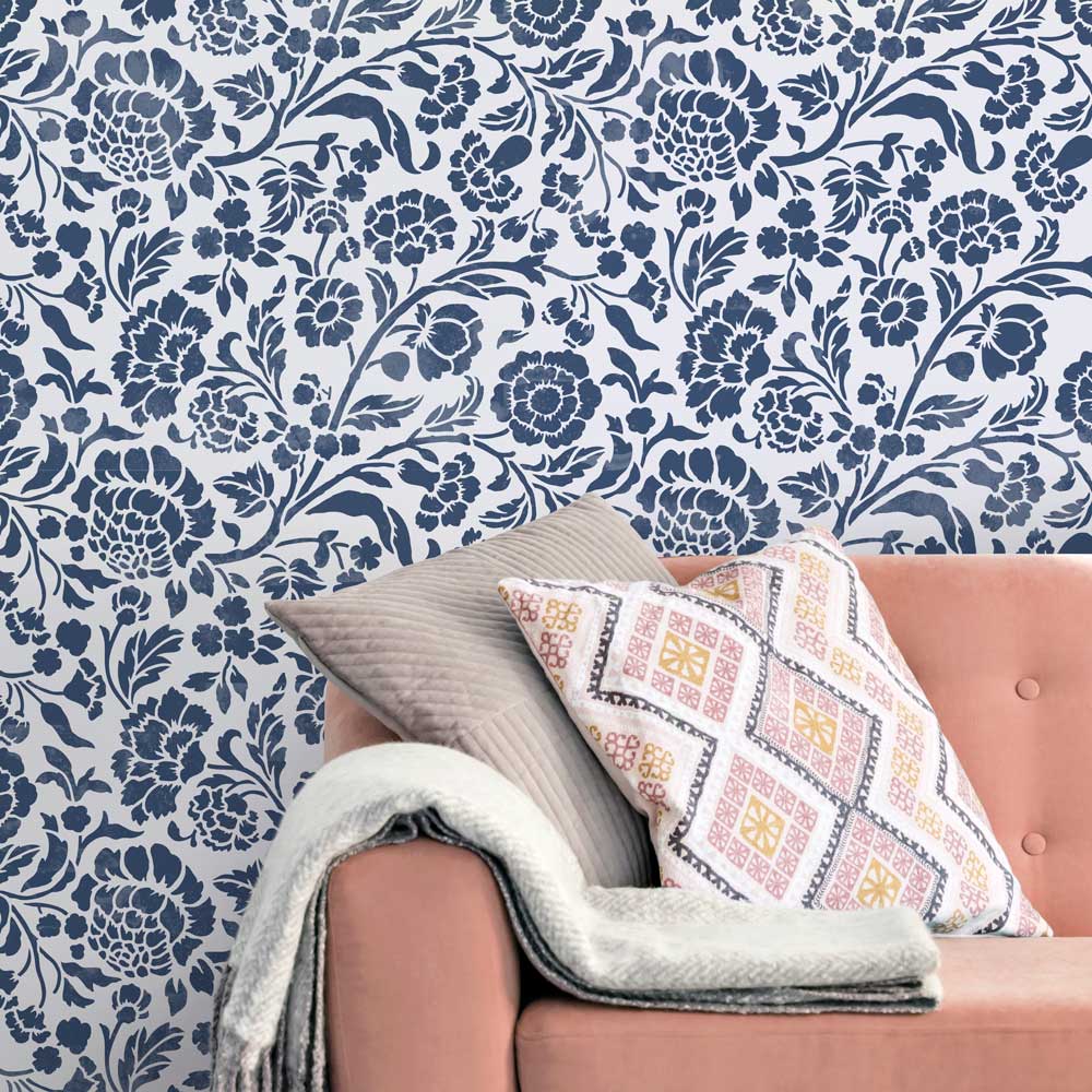 pink couch white wall dark blue foral wall stencil design