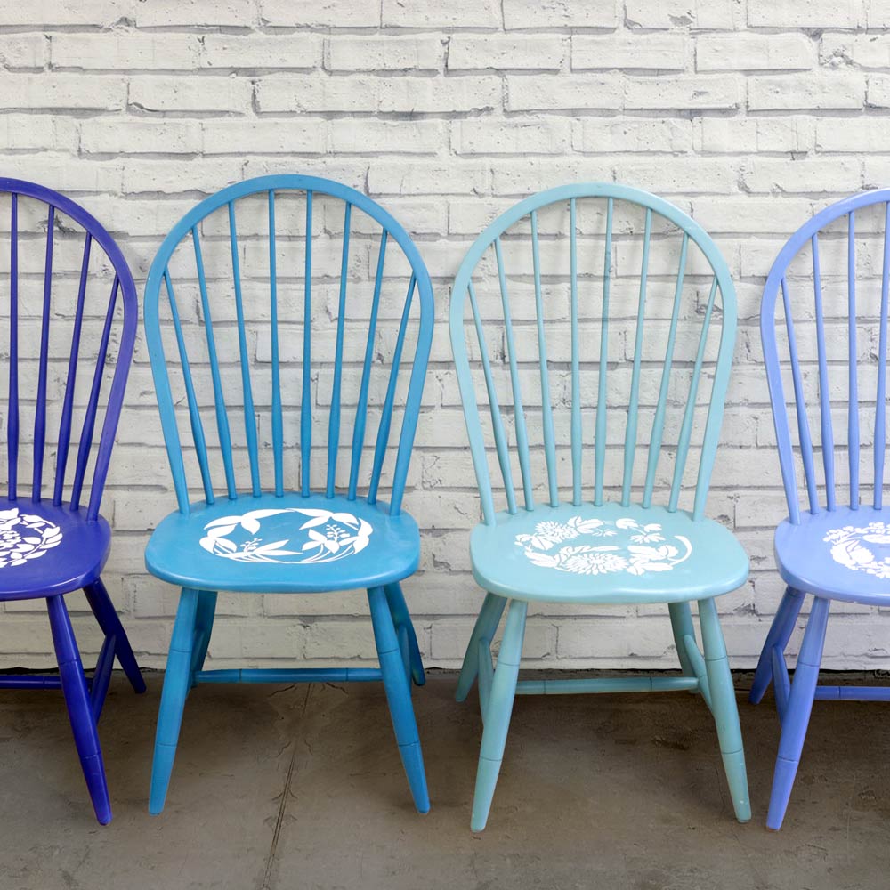 Chrysanthemum Twist Stencil on group of blue chairs