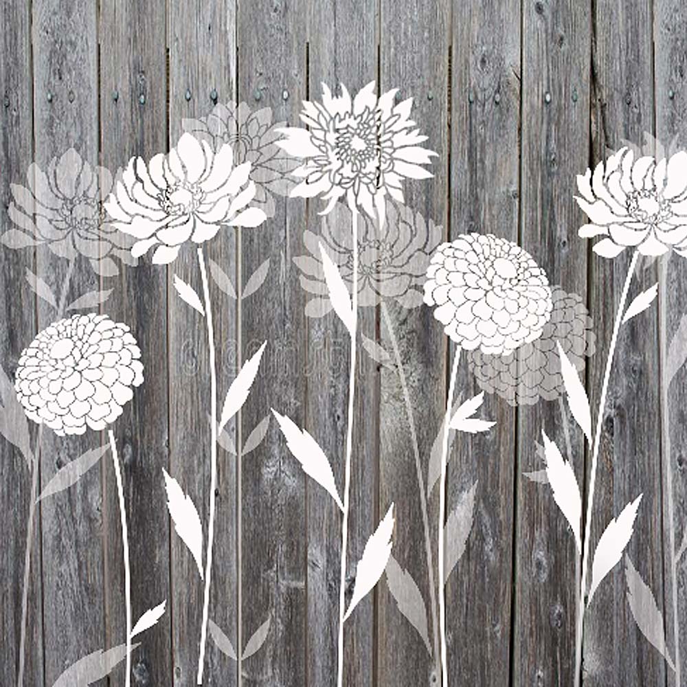 flower stencils painted on a wooden fence