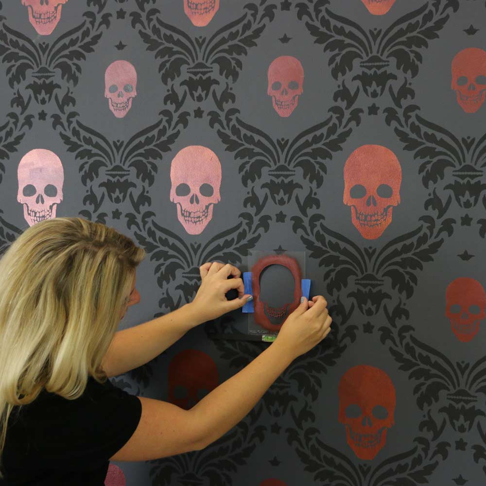 skull halloween craft stencil painted on accent wall