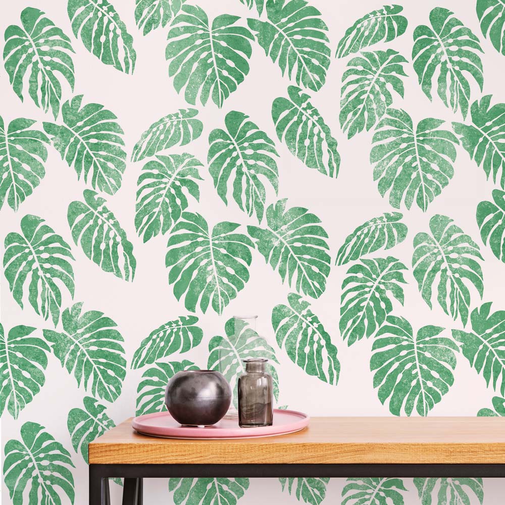 green stenciled monstera wall