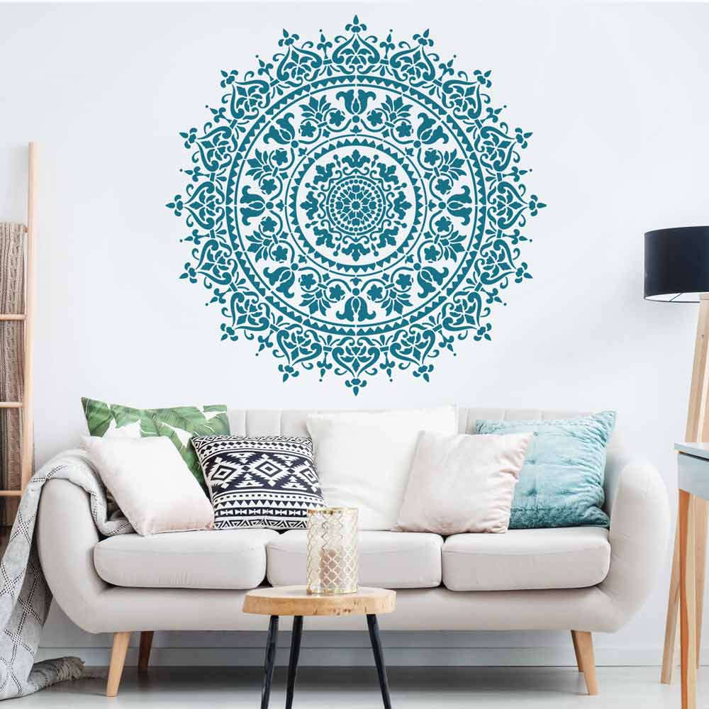 prosperity wall stencil pattern in blue above couch