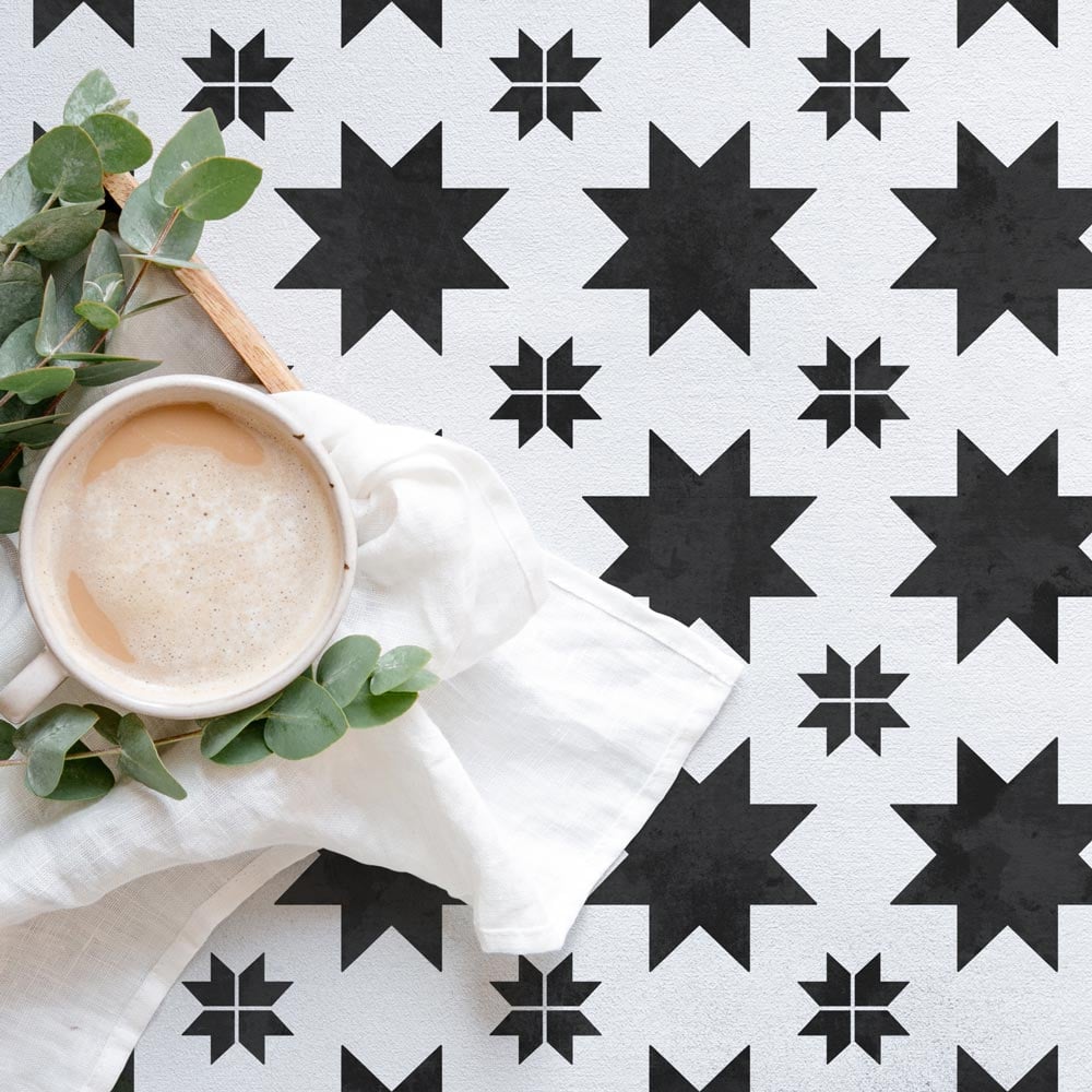 white and black stenciled floor quilted star tile floor coffee