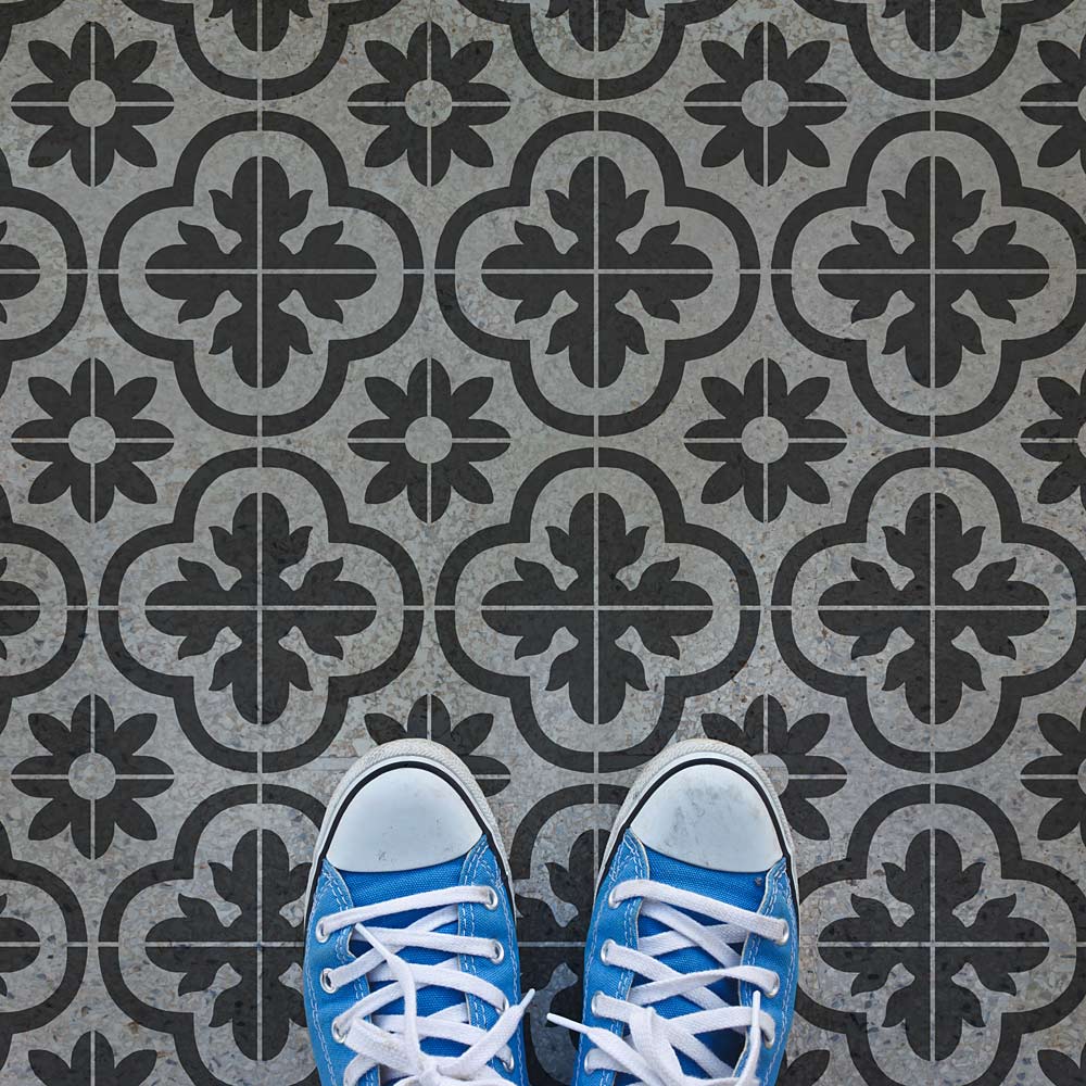 Cement tile floor stenciled design