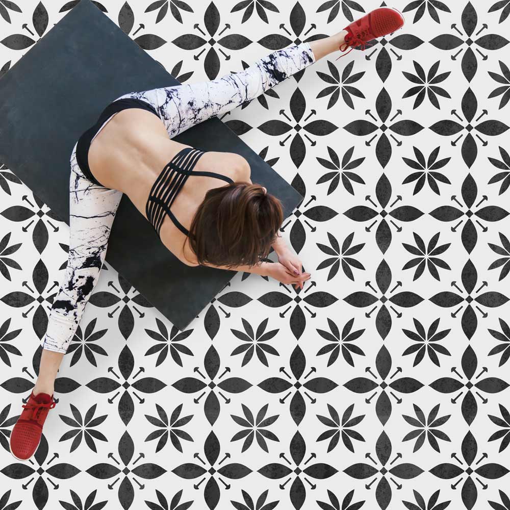 black and white starflower tile stenciled floor  yoga studio