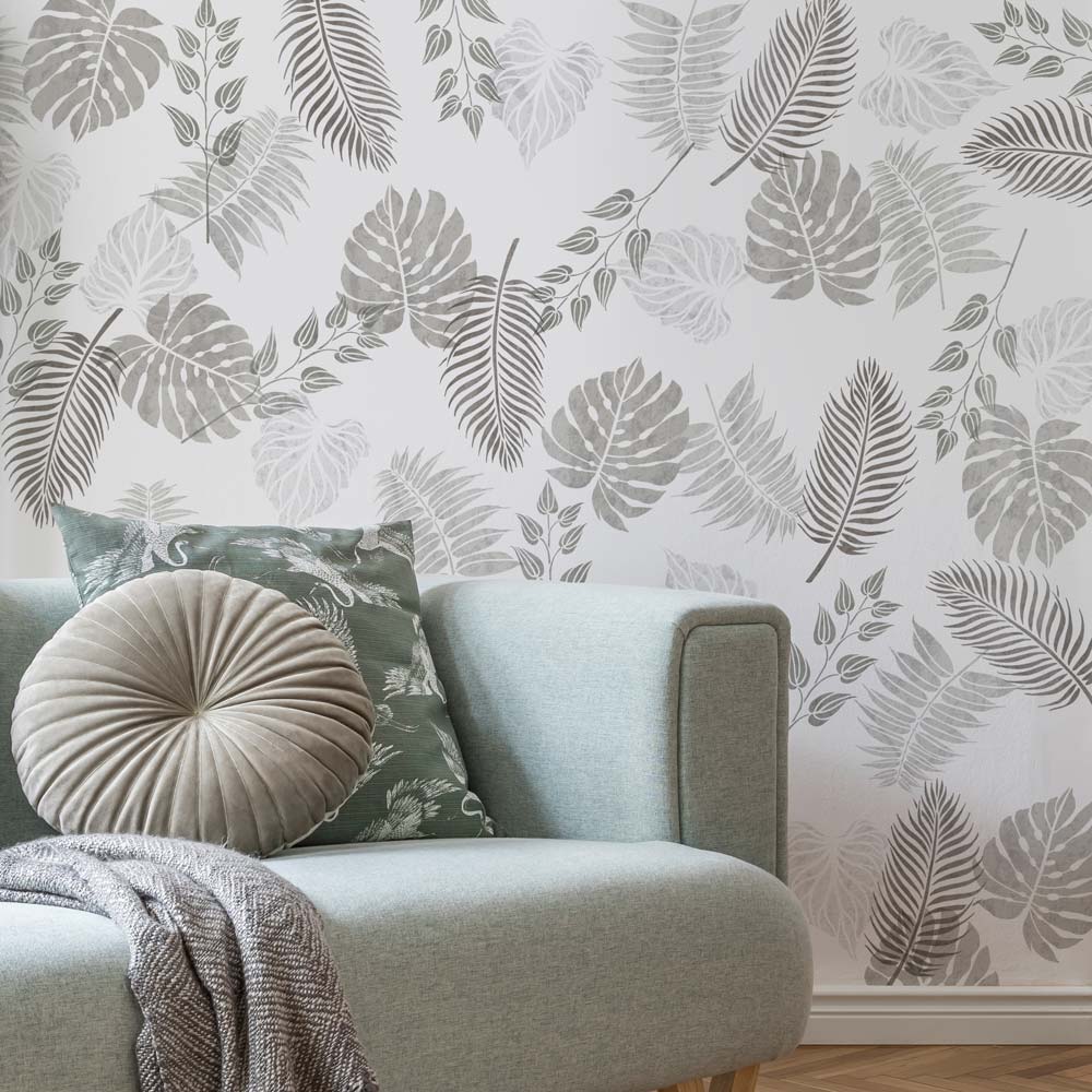 Grey scale stenciled tropical leaf kit wall