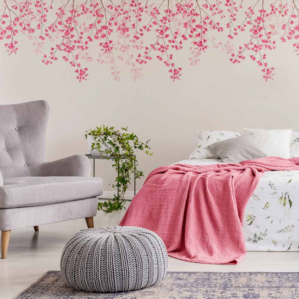 pink weeping cherry blossom stencil on a bedroom wall