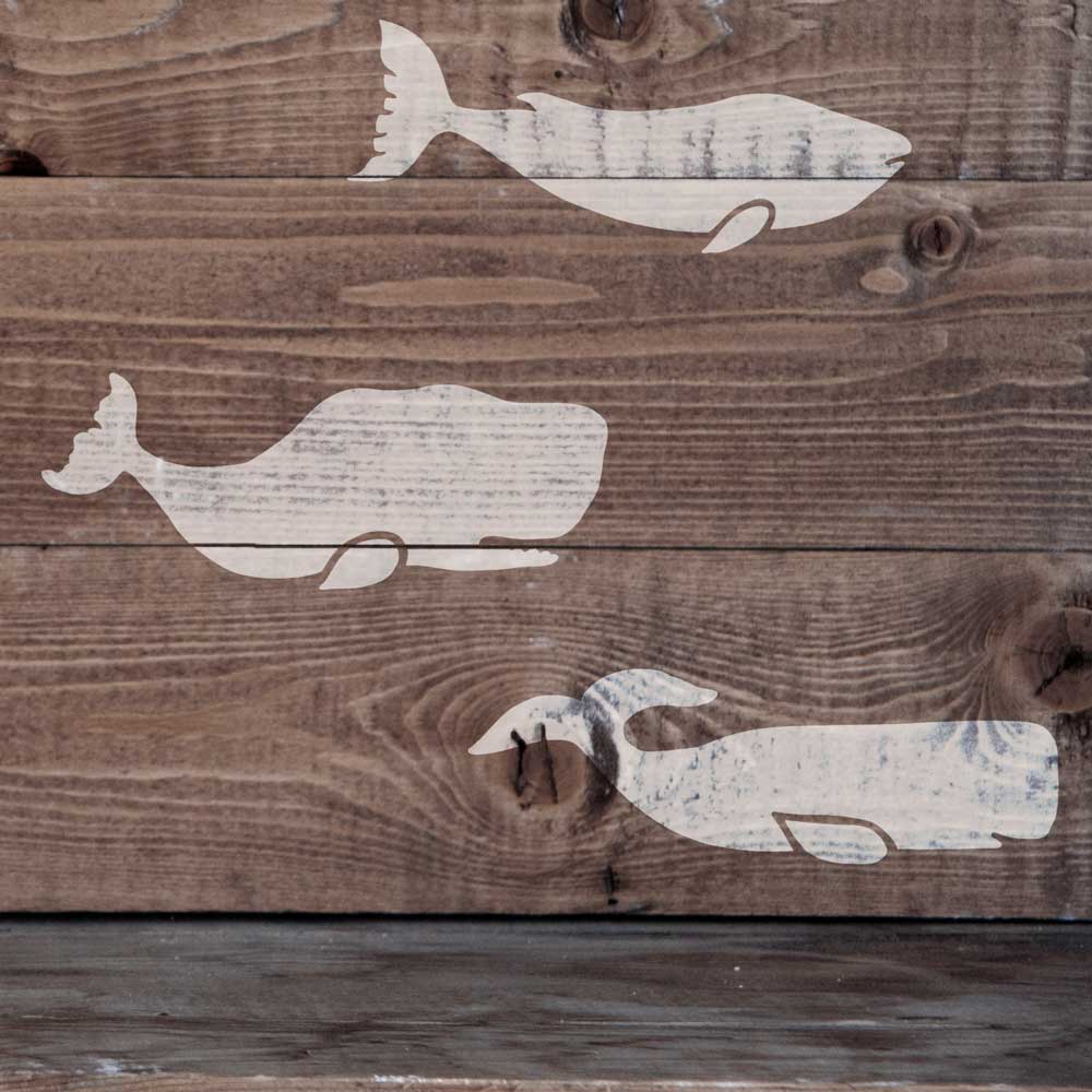 white whale stencil on wood boards 